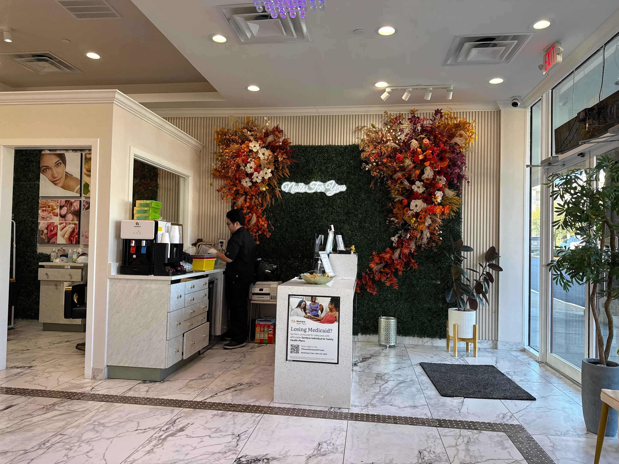 The Nails For You reception and flower wall at Seven Corners, Falls Church